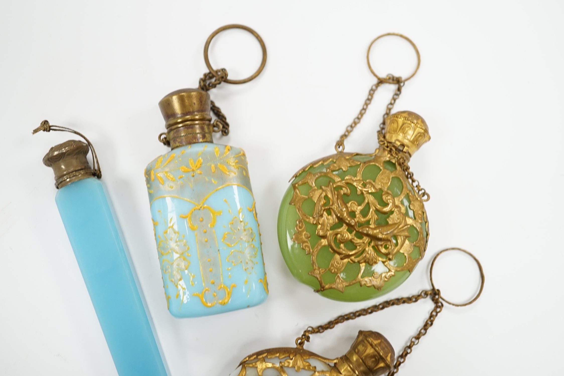 A group of four glass scent bottles with gilt metal mounts, largest 9cm high